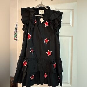 Fantastic Fawn black ruffle dress with red sequin stars
